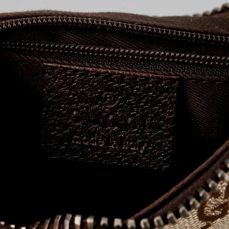 GUCCI, a beige monogram canvas shoulderhandbag.