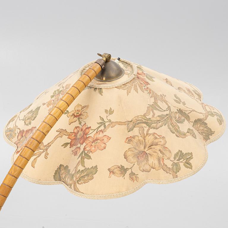 A 1930's/40's floor lamp with table.