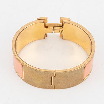 Hermès, a 'Clic Clac H' bracelet.