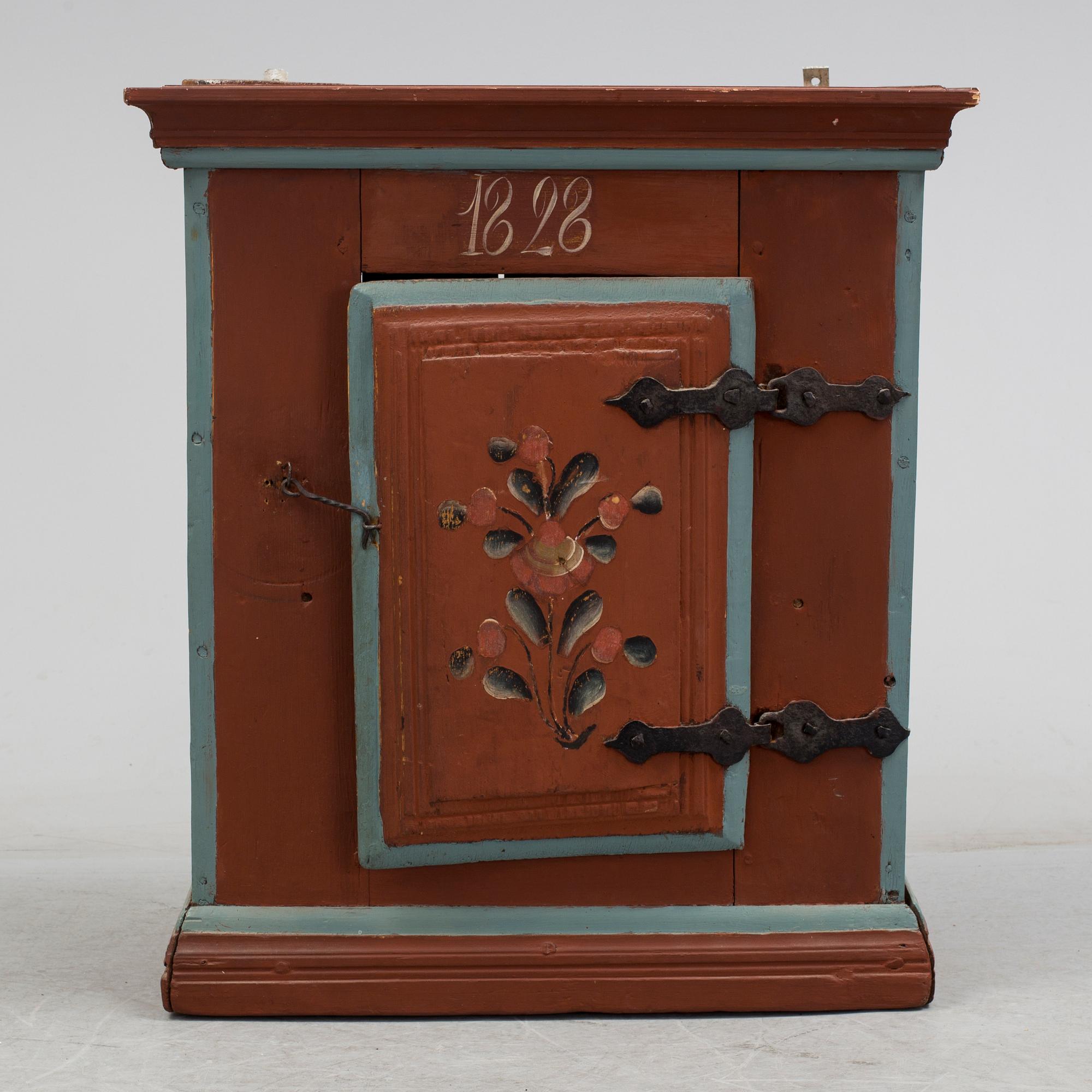 a painted cabinet dated 1828.