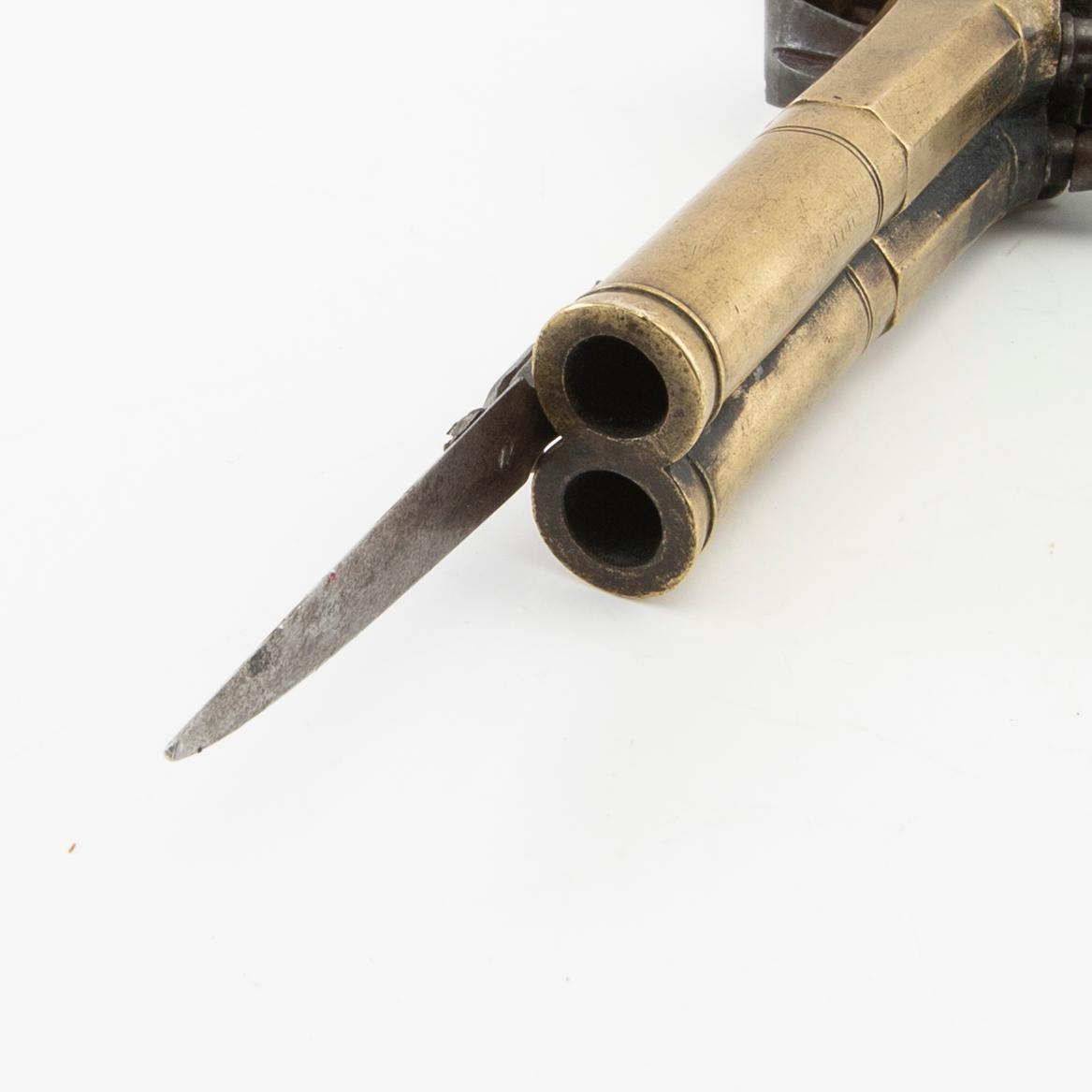 Double-barrel percussion pistol with bayonet, 19th century.