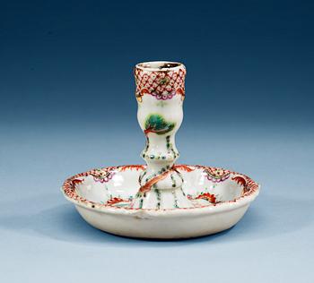 A famille rose 'European subject' candle stick, Qing dynasty, Qianlong (1736-95).