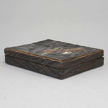 A Japanese lacquered wooden box, Meiji period (1868-1912). Signed inside cover.