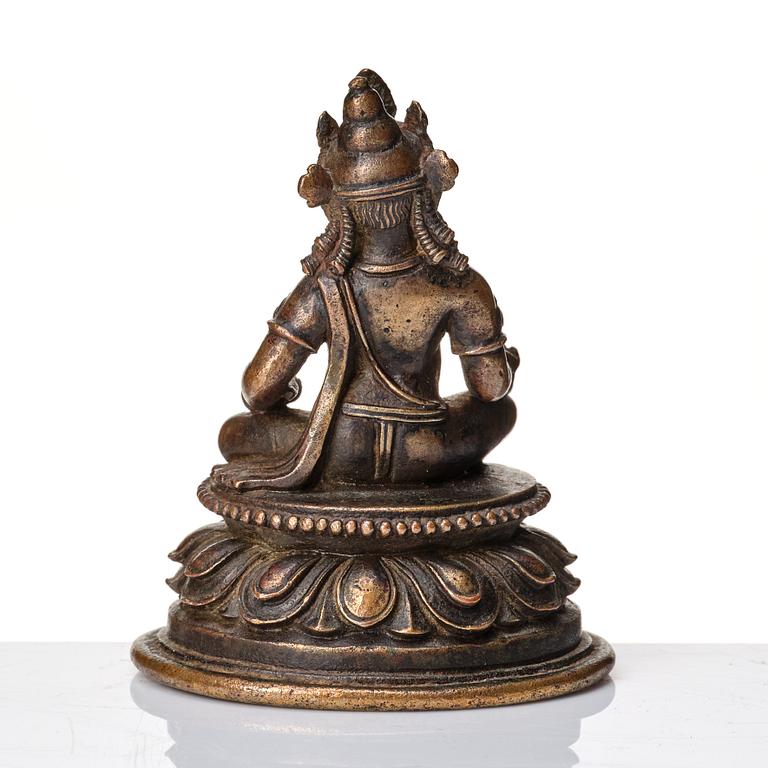 A copper alloy figure of Jambhala, Nepal, possibly 12/13th Century.