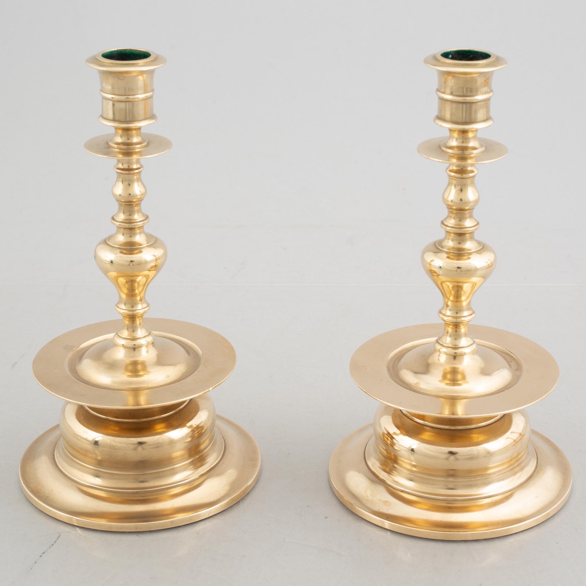 Two pairs of brass candlesticks, 19th century - early 20th century.