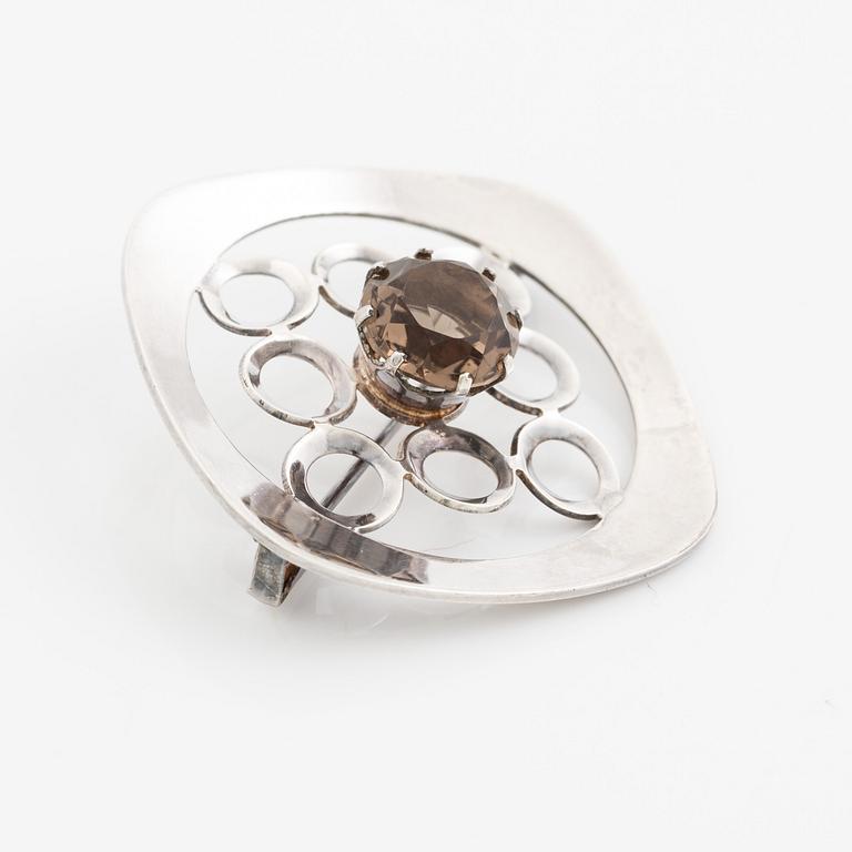 Arm ring and brooch, silver with smoky quartz, Kultasepät Salovaara.