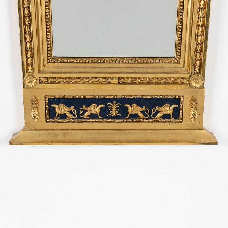 An Empire mirror, first half of the 19th Century.