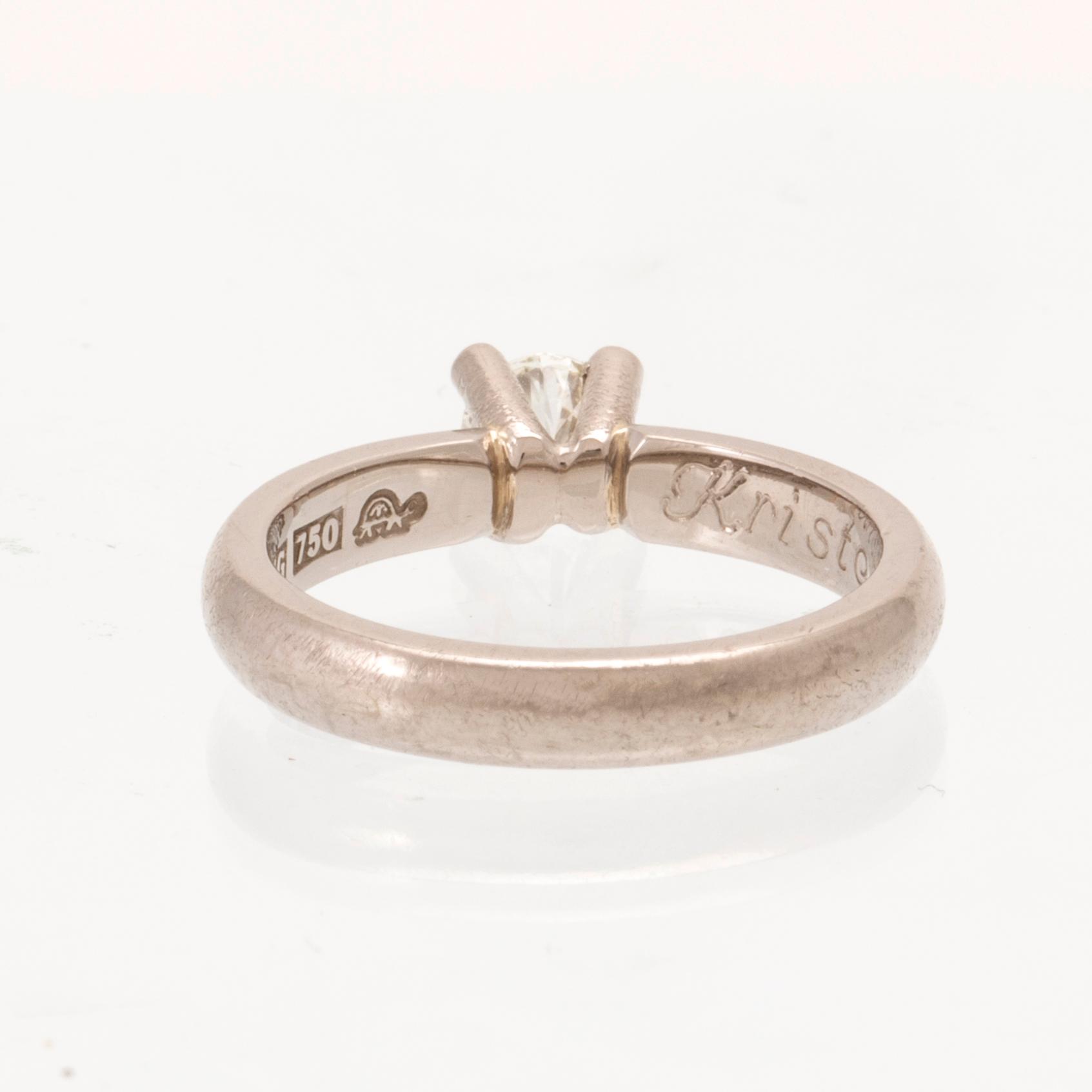 An 18K white gold solitaire ring set with a round brilliant-cut diamond, Sandberg.