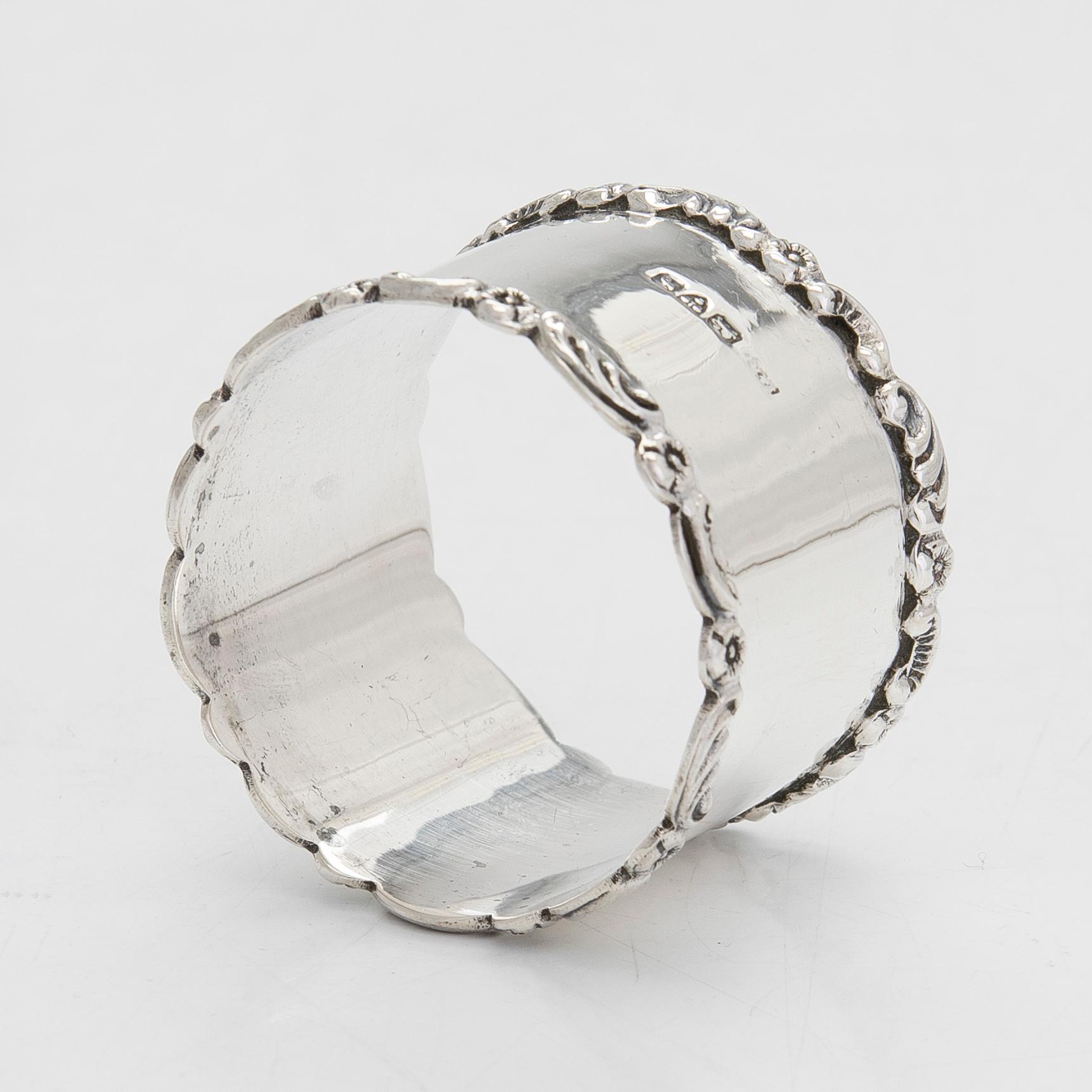 A sterling silver egg cup and napkin ring in original fitted case, Chester 1909.