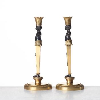 A pair of Empire style candlesticks. Late 19th century.