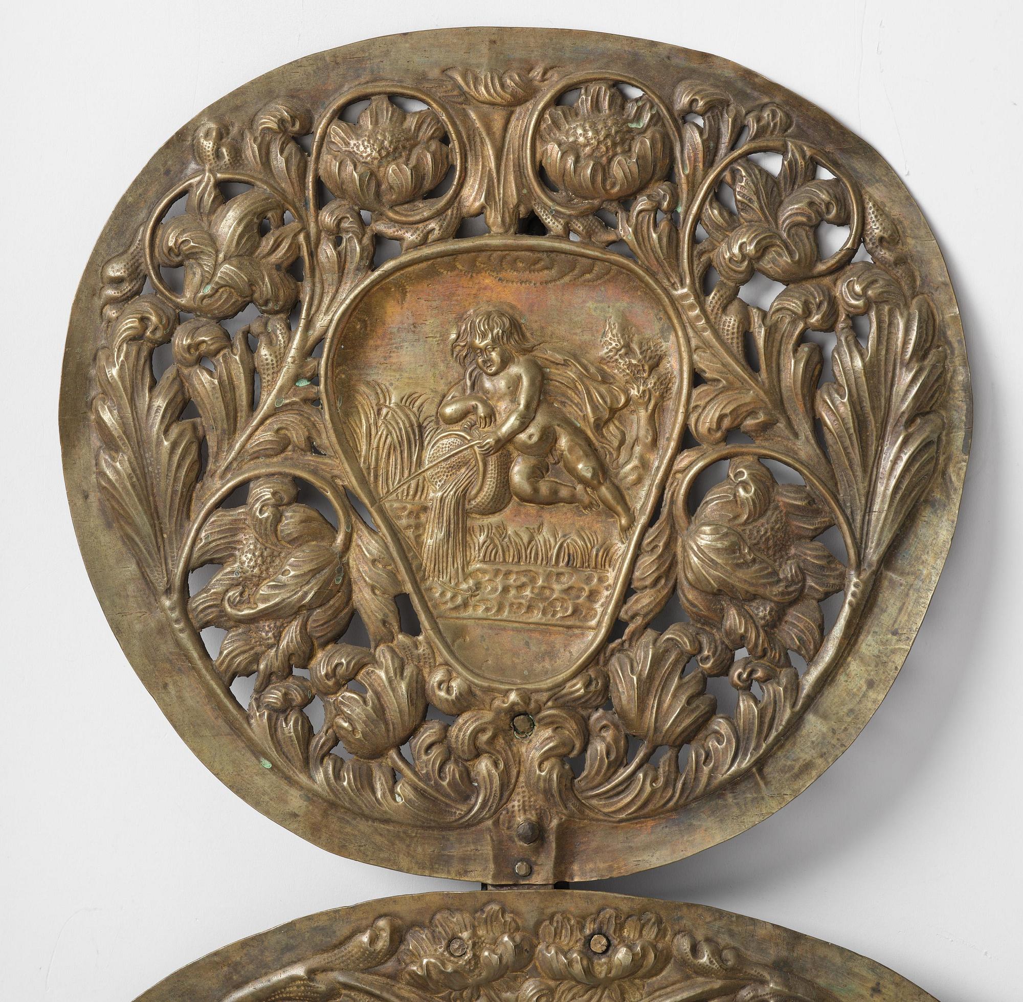 A set of four Swedish Baroque repoussé silvered brass reflector one-branch reflector plates, ca 1690-1700.