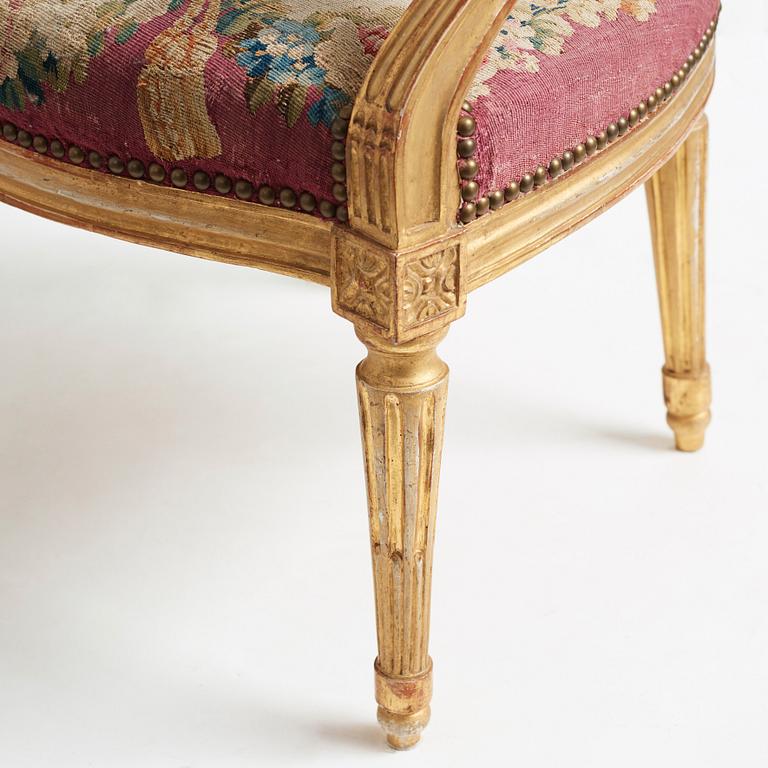 A set of four Louis XVI armchairs.