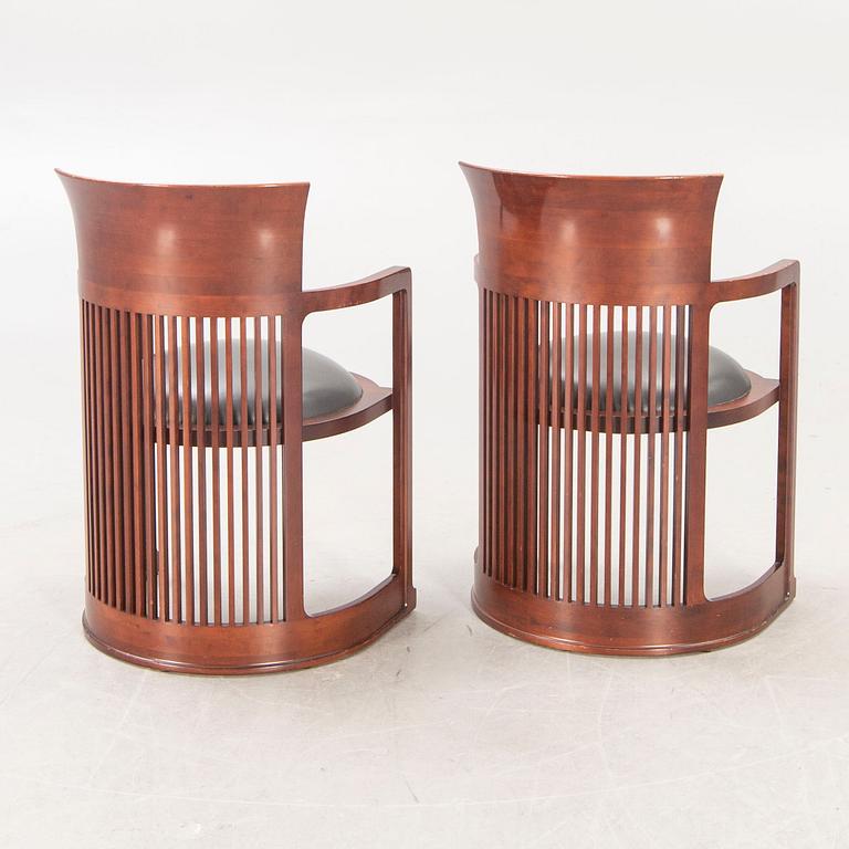 A pair of "606 Barrel Taliesin" armchairs by Frank Lloyd Wright for Cassina 1989, signed and numbered 28459, 28581.