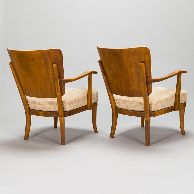 Einari Kyöstilä, a pair of 1940s open armchairs for Oy Stockmann Ab, Keravan Puusepäntehdas, Finland.