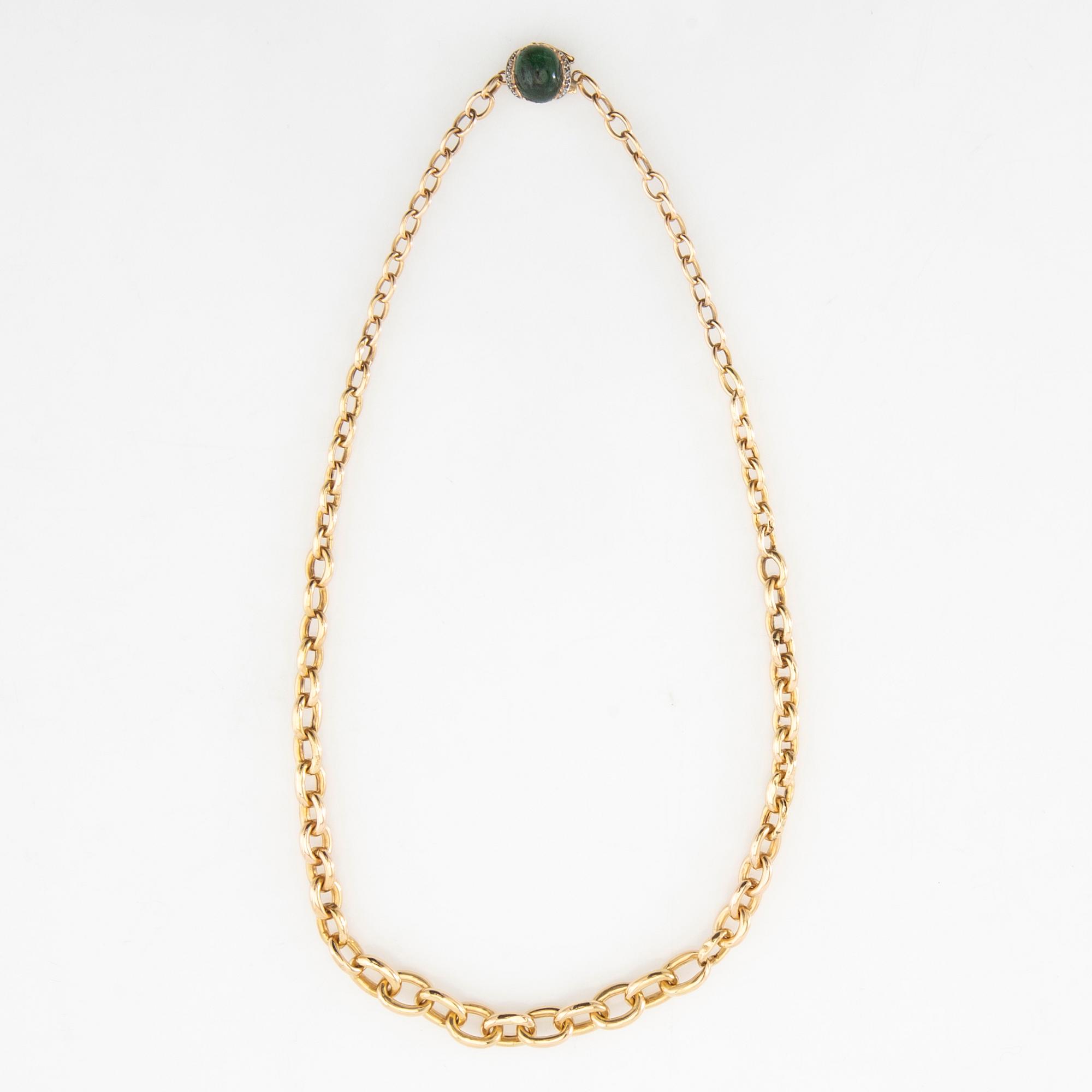 Necklace 18K gold with a cabochon-cut green tourmaline and rose-cut diamonds.
