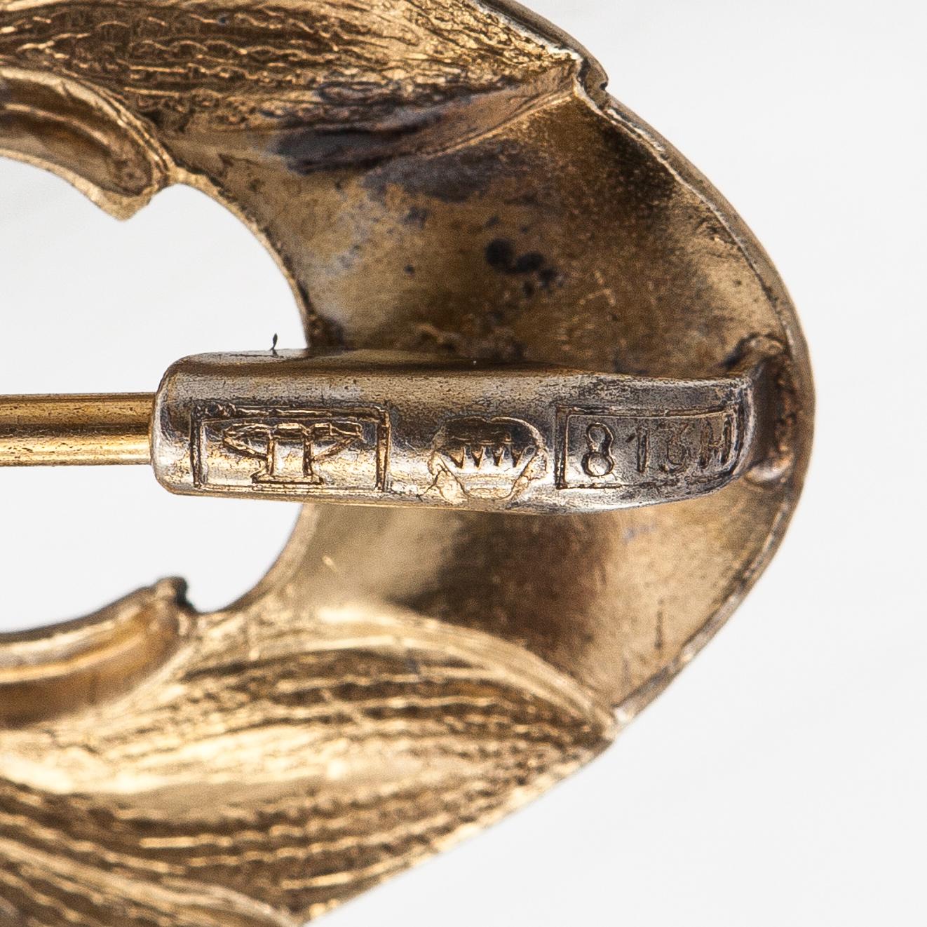 Elis Kauppi, A gilded silver brooch with a glass stone. Kupittaan kulta, Turku, 1940's.