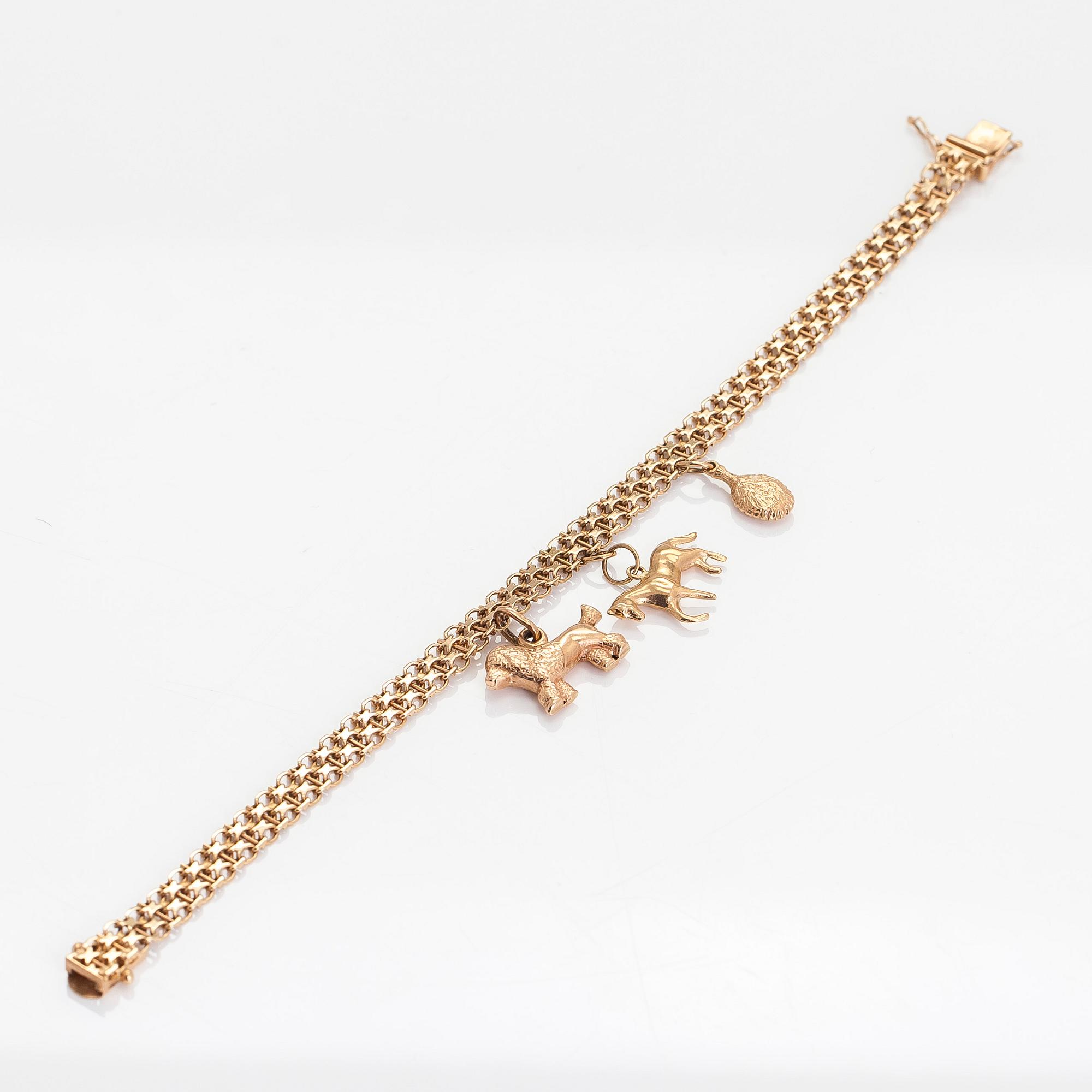 Armband, x-länk, 14K guld med berlocker. Finska importstämplar 1967.