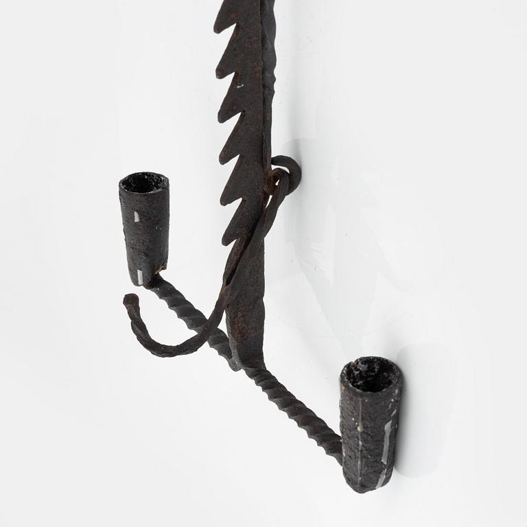 A wrought-iron two-light candlestick, 19th/20th Century.