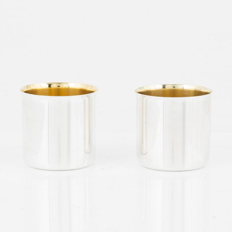 A set of eight parcel gilt Swedish silver vodka cups, bearing the mark of GAB, Stockholm, 1966-1970.