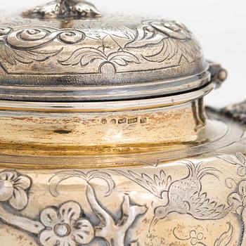 A 9-piece parcel-gilt sterling silver tea set, maker's mark of Samuel Smily, Goldsmiths Alliance Ltd, London 1873-74.