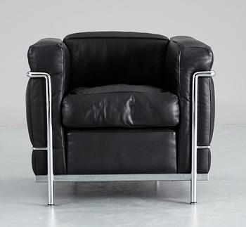 A pair of Le Corbusier 'LC 2' black leather and chromed steel easy chairs, Cassina, Italy.