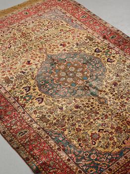 A rug, a semi-antique silk Turkish with metal brocade, ca 194-195 x 127,5-132,5 cm.