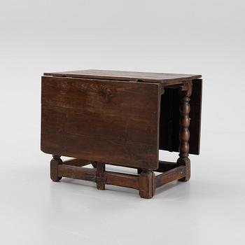 A baroque gate-leg table, 18th century.