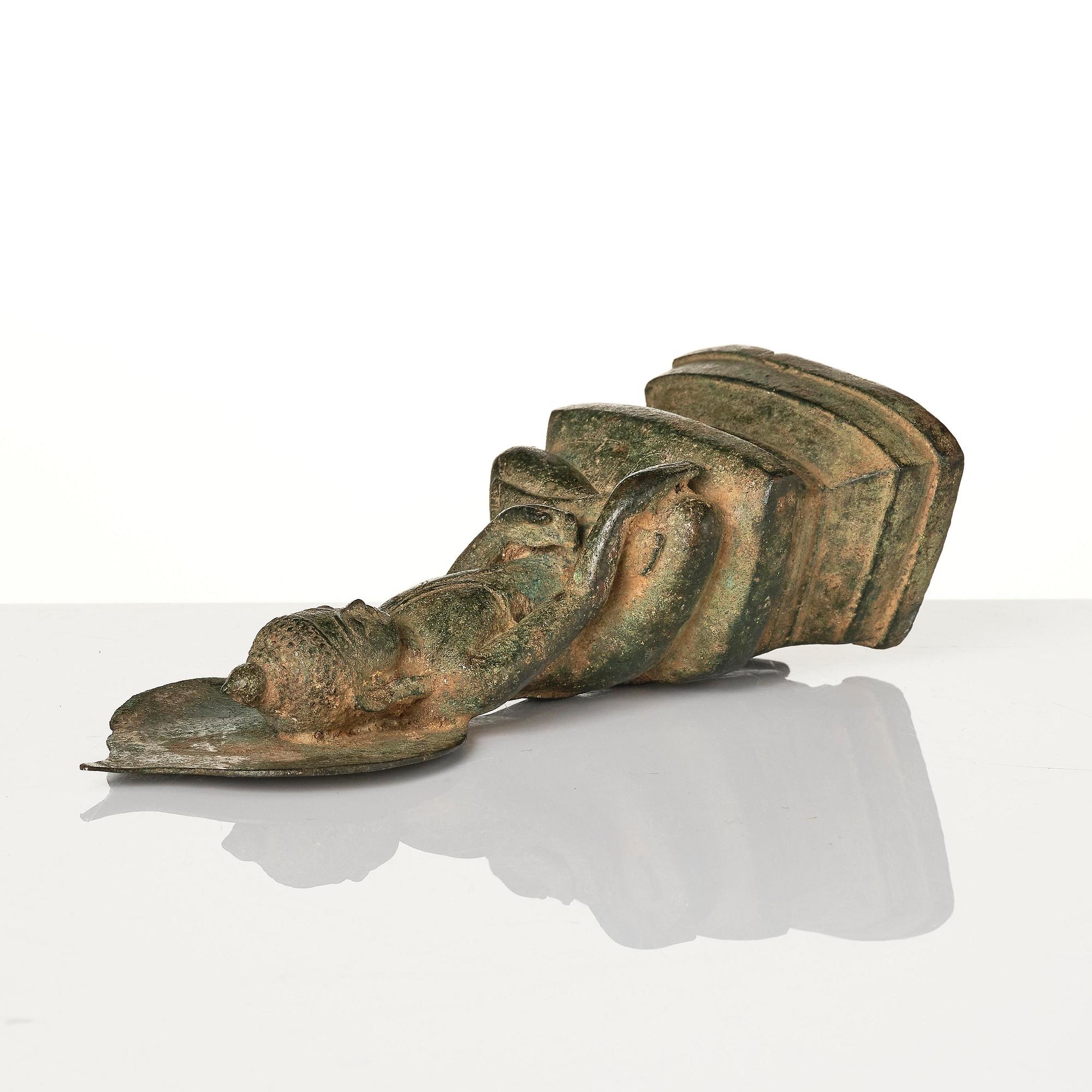 A bronze figure of Buddha with a halo, Burma, 16th century.