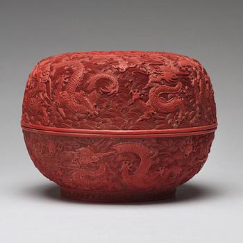 A carved red dragon box with cover, Qing dynasty (1662-1912).