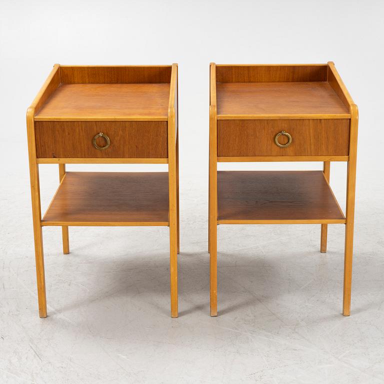 A pair of teak veneered bedside table, mid 20th Century.