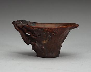 A carved rhinoceros libation cup, Qing dynasty, 18th Century.