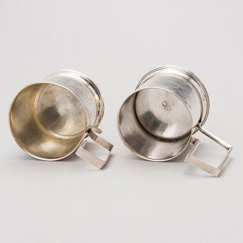Two tea glass holders in silver, one with mark of Ivan Saltykov, Moscow 1889, the other one marked Moscow 1908-1917.