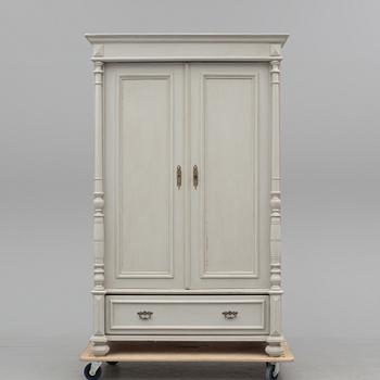 A wardrobe, circa 1900.