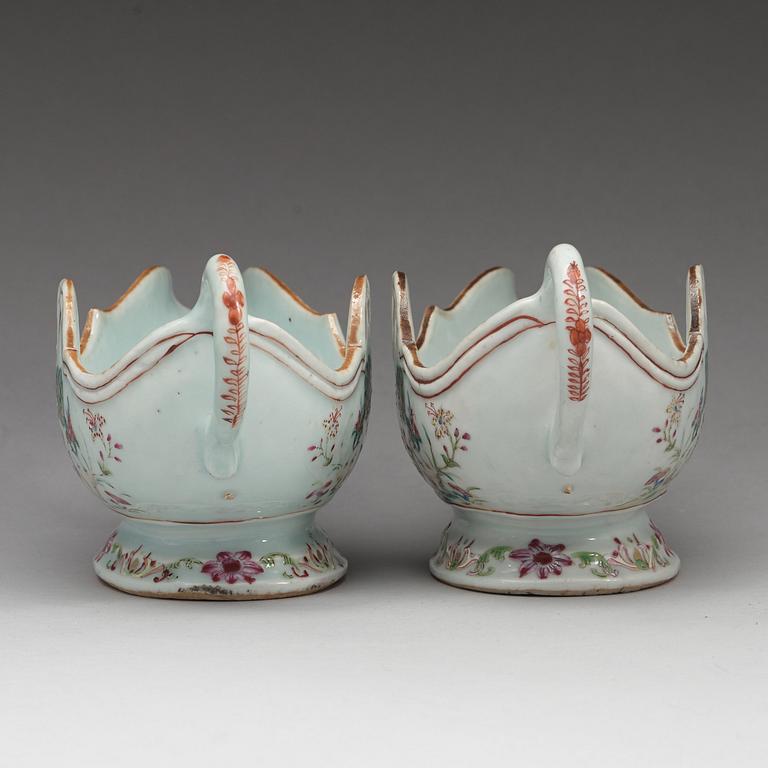 A pair of famille rose 'double peacock' sauce boats, Qing dynasty, Qianlong (1736-95).