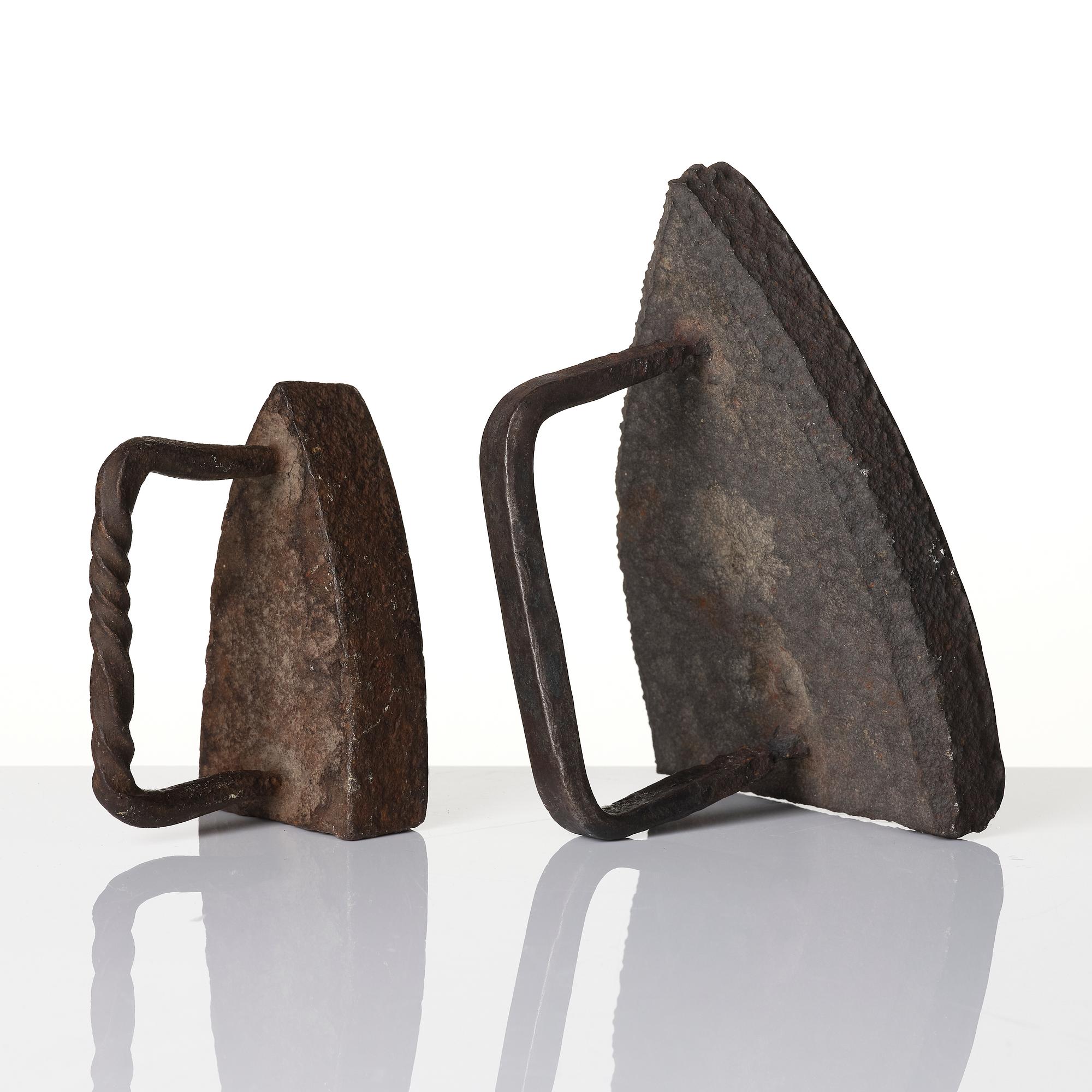 Two cast iron clothes irons, 18th / early 19th century.