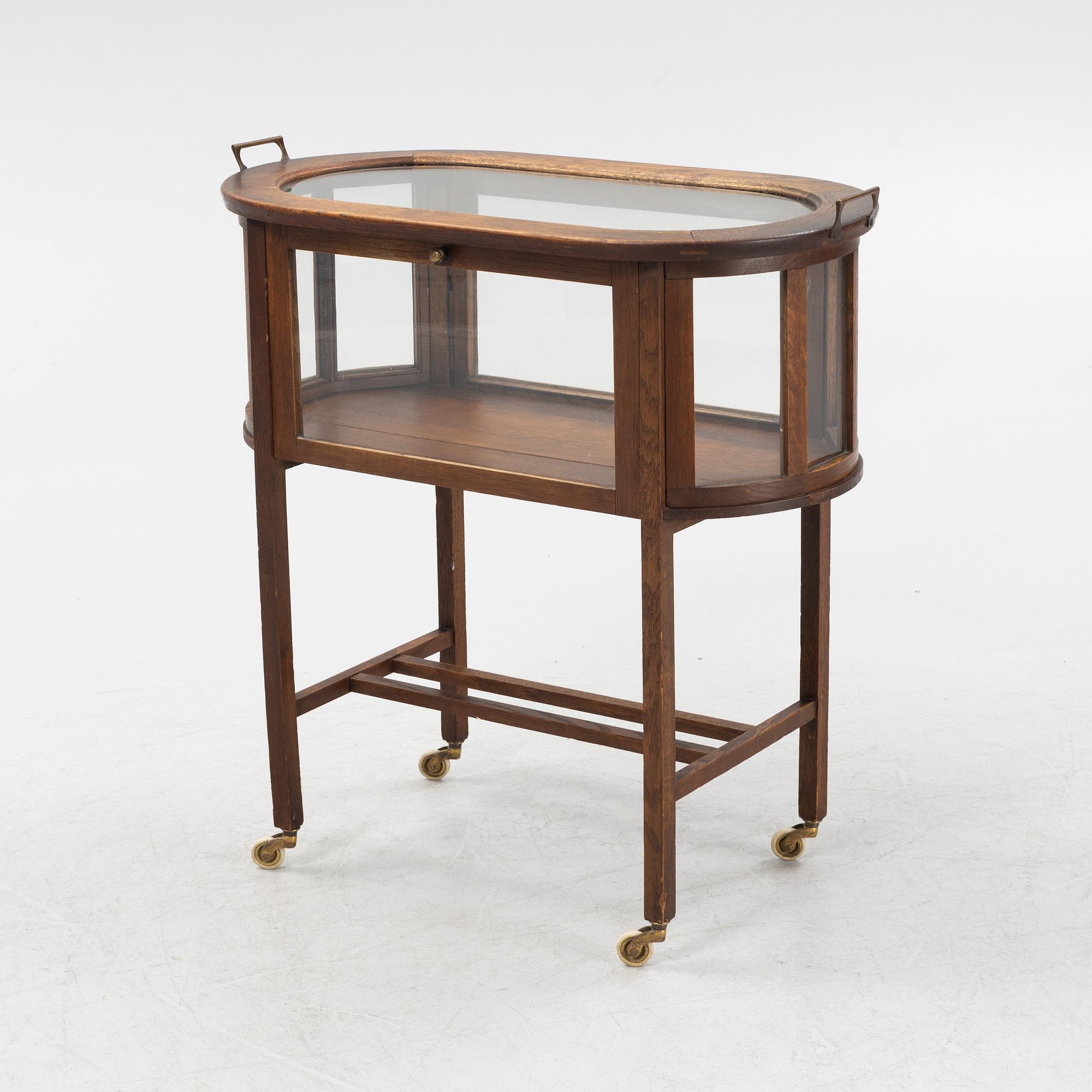An oak tea trolley, early 20th Century.