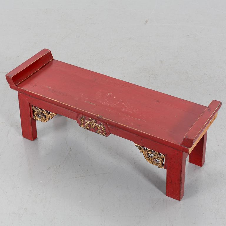 A Chinese 20th century painted wooden bench.