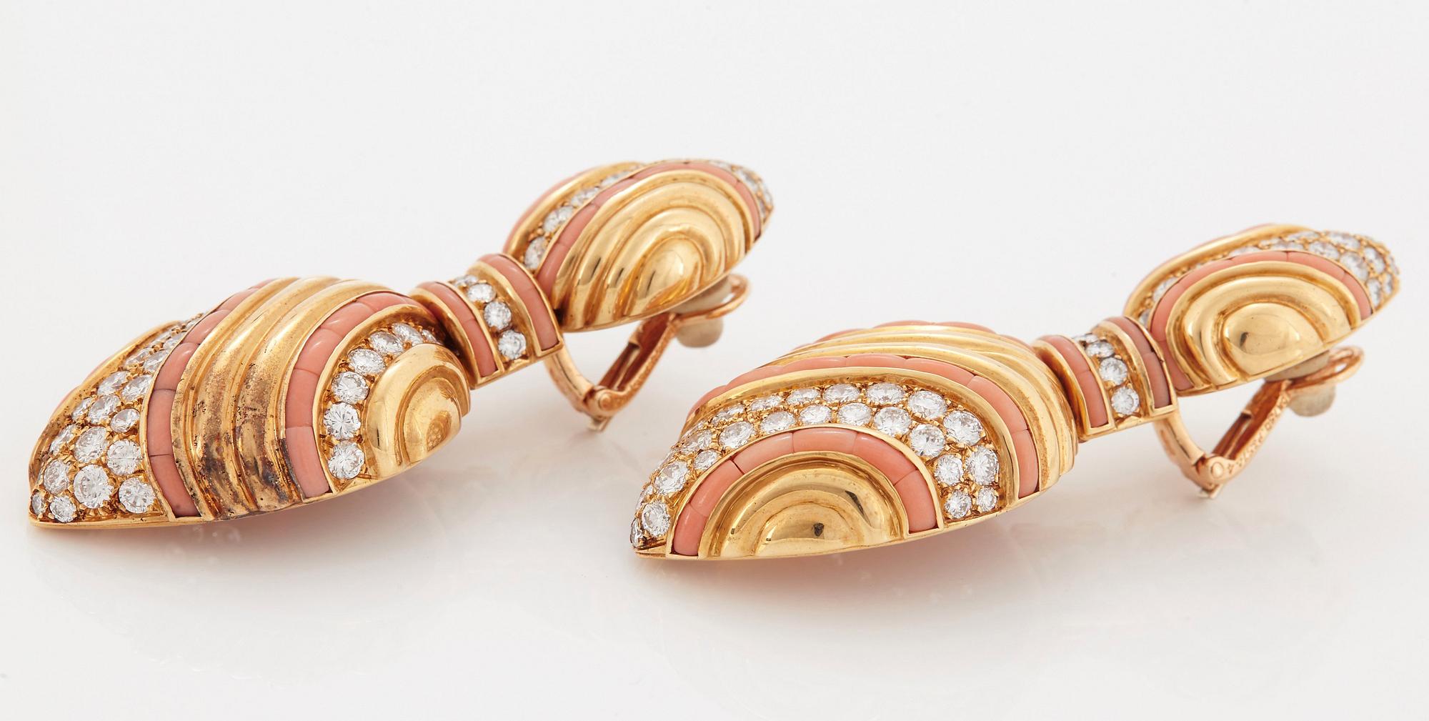 A pair of 18K gold Boucheron earrings set with round brilliant-cut diamonds and coral.