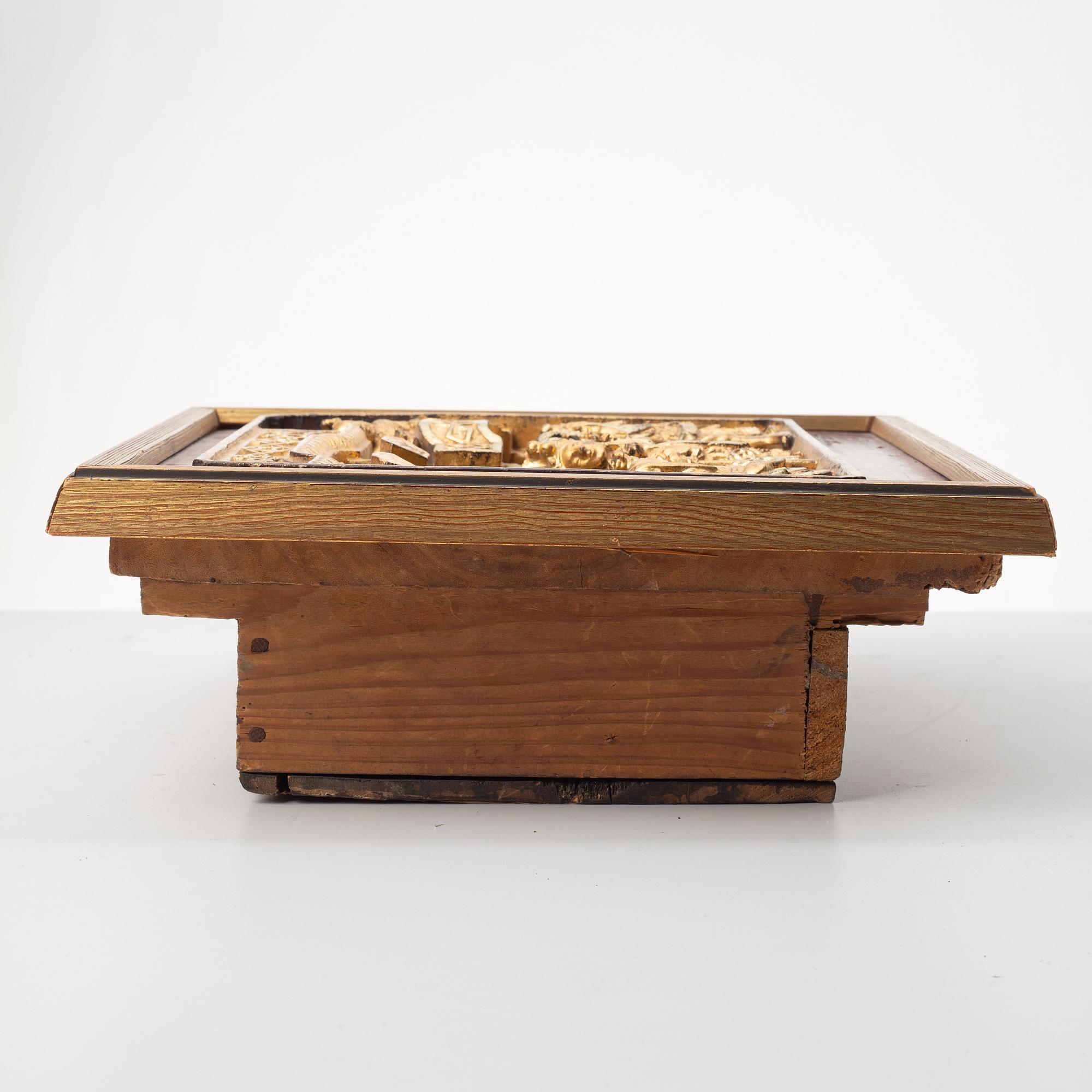 A Chinese wooden panel in deep relief, Qing dynasty, 19th century.