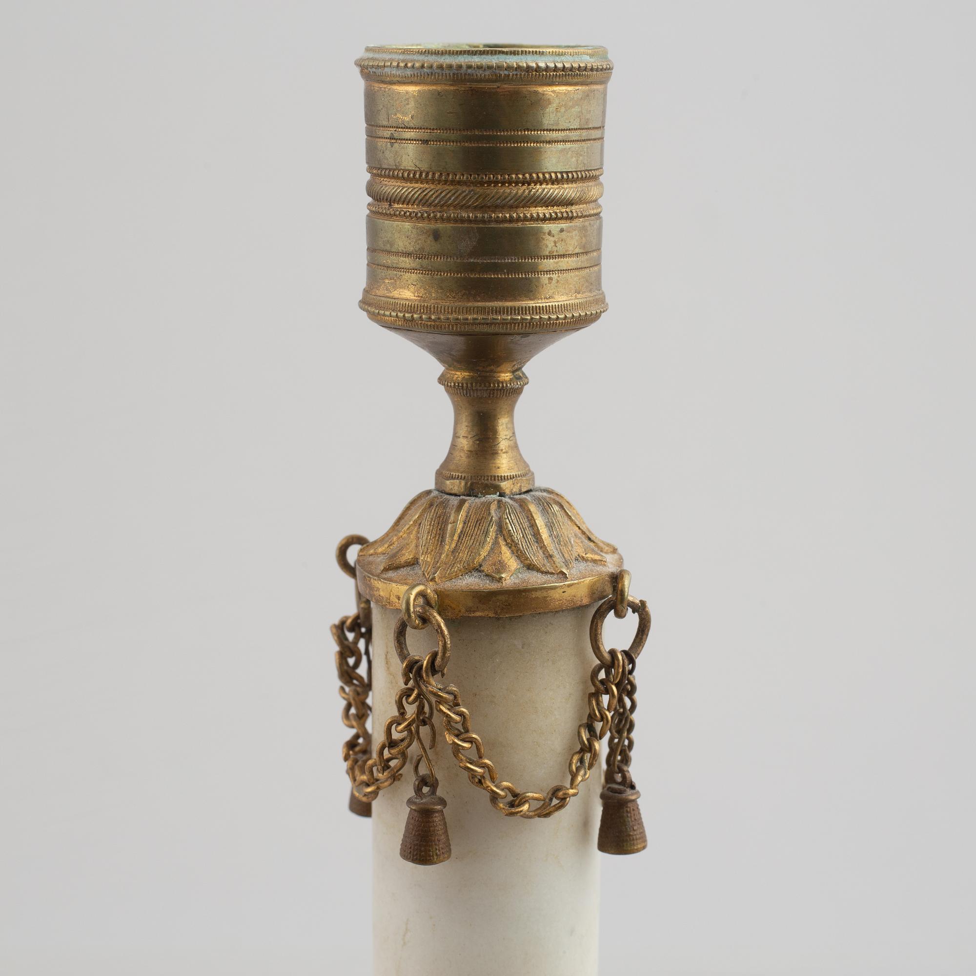 A late Gustavian gilt brass and marble candlestick, late 18th century.