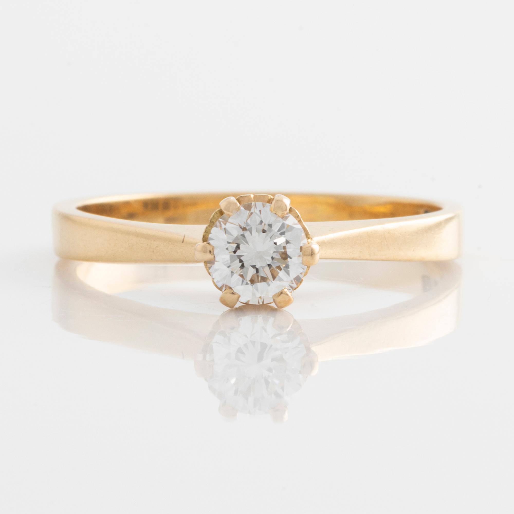 Ring, 18K guld med briljantslipad diamant.