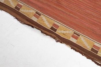 A flat weave carpet, c. 360 x 265 cm.