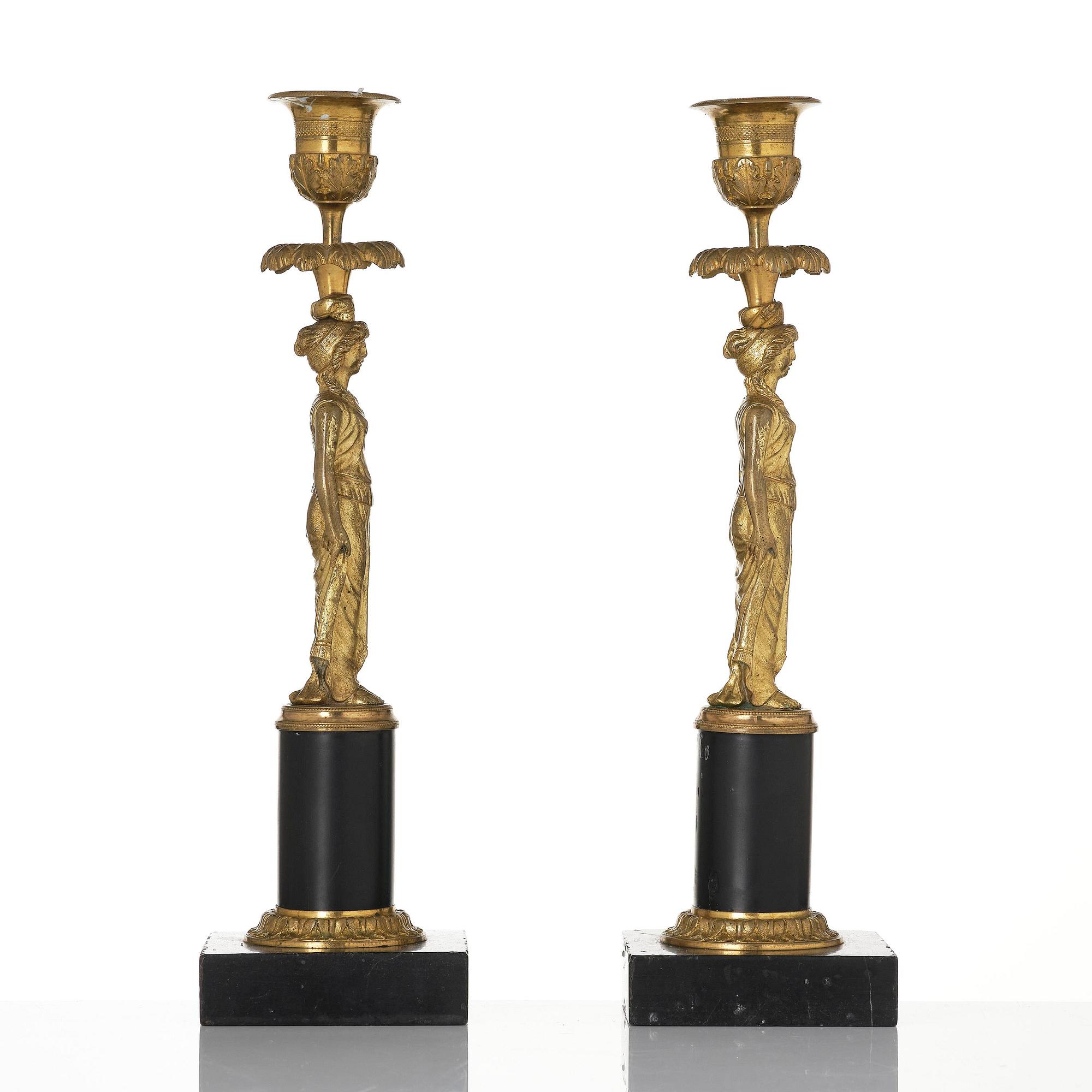 A pair of late Gustavian marble and ormolu candlesticks attributed to F. L. Rung (1758-1837).