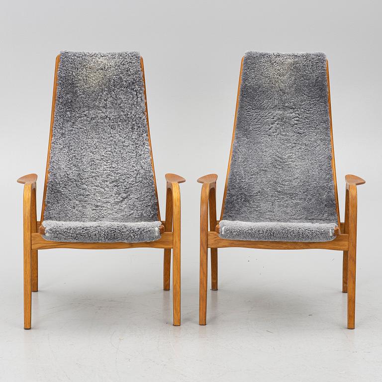 Yngve Ekström, A pair of armchairs, a footstool, “Lamino”, and a side table, Swedese, 2000s.
