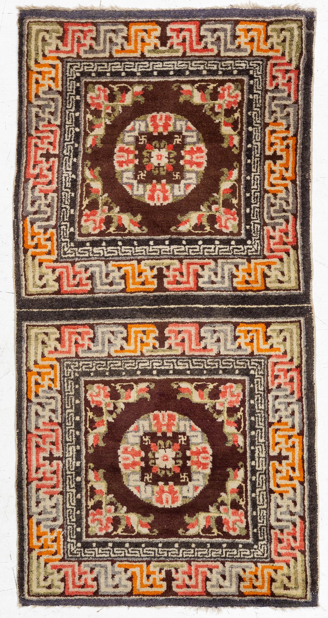 A Chinese two square rug, antique, c. 142 x 71 cm.