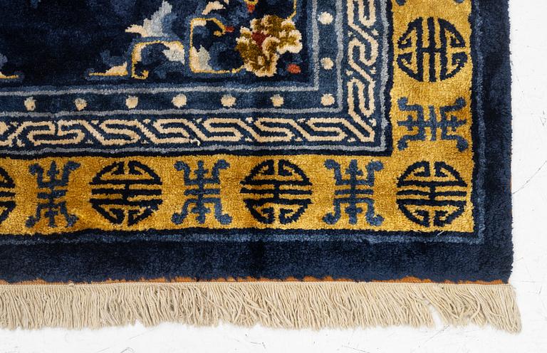 A semi-antique silk Chinaese 'Antique finish' rug, c. 175 x 122 cm.