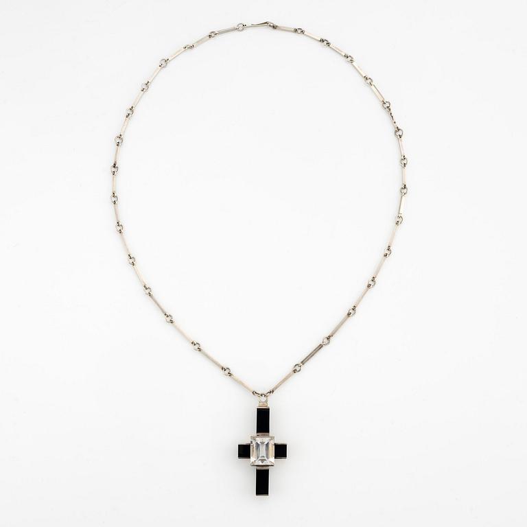 Wiwen Nilsson, a pendant, silver with rock crystal and onyx, in the form of a cross, Lund 1939.