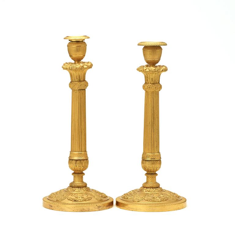 A pair of Empire early 19th century candlesticks.