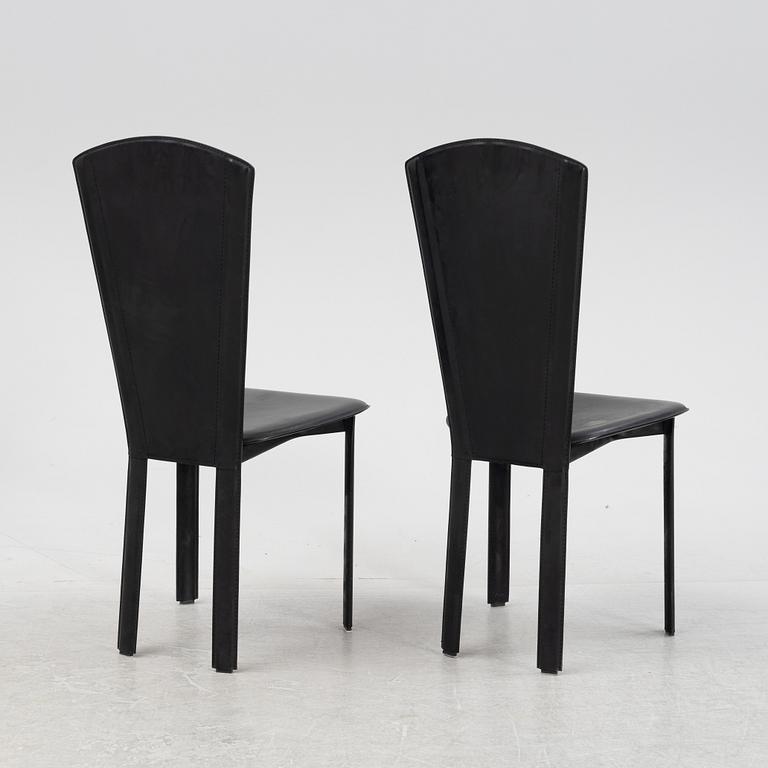 Twelve black leather 'Sossano' chairs, Quia, Italy.