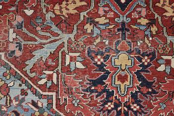 An Antique Heriz carpet, North west persia, c. 380 x 310 cm.